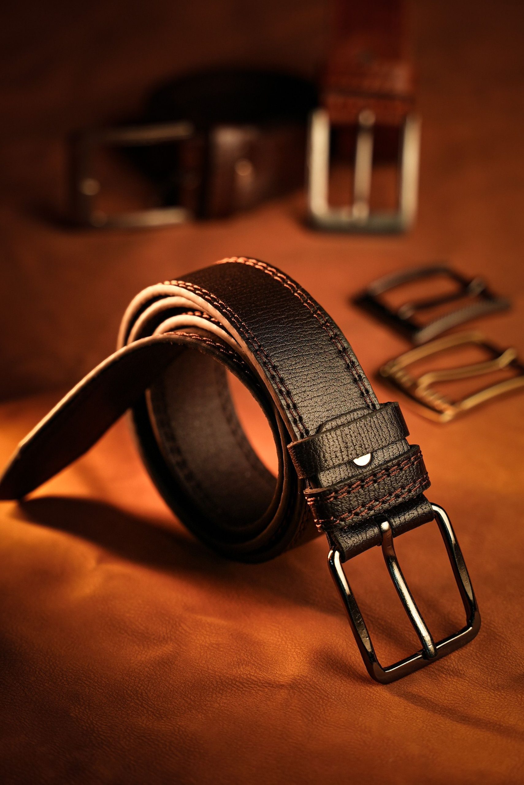 Premium leather belts in classic colours.