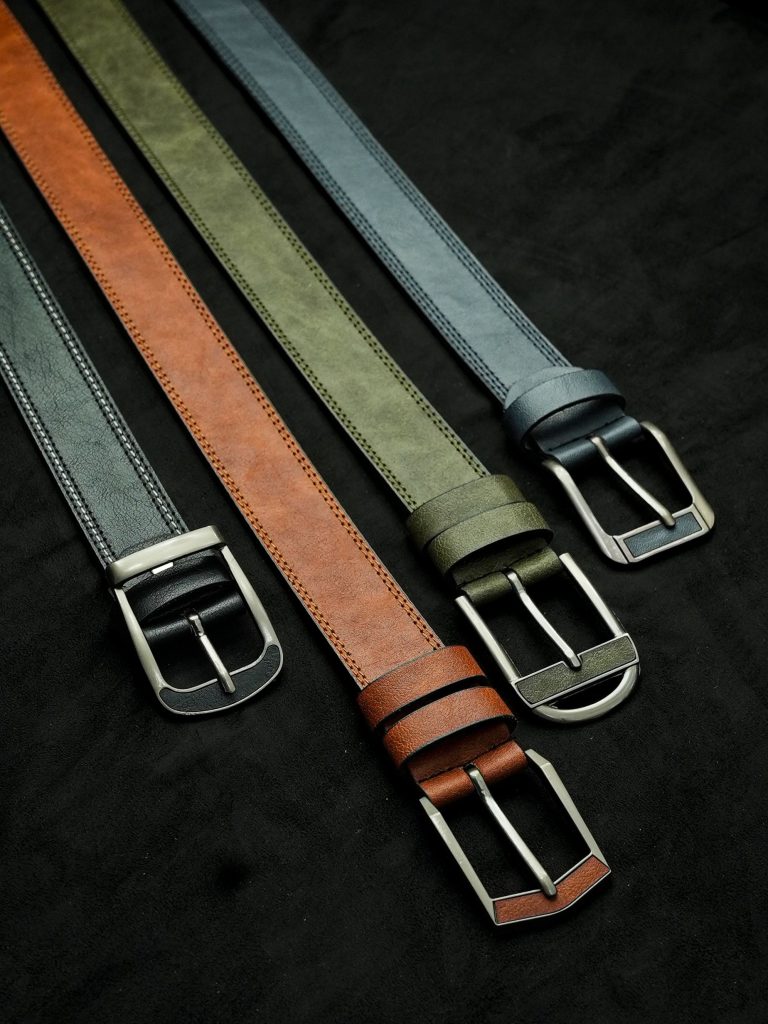 Leather belts stored correctly in a gentleman's wardrobe.