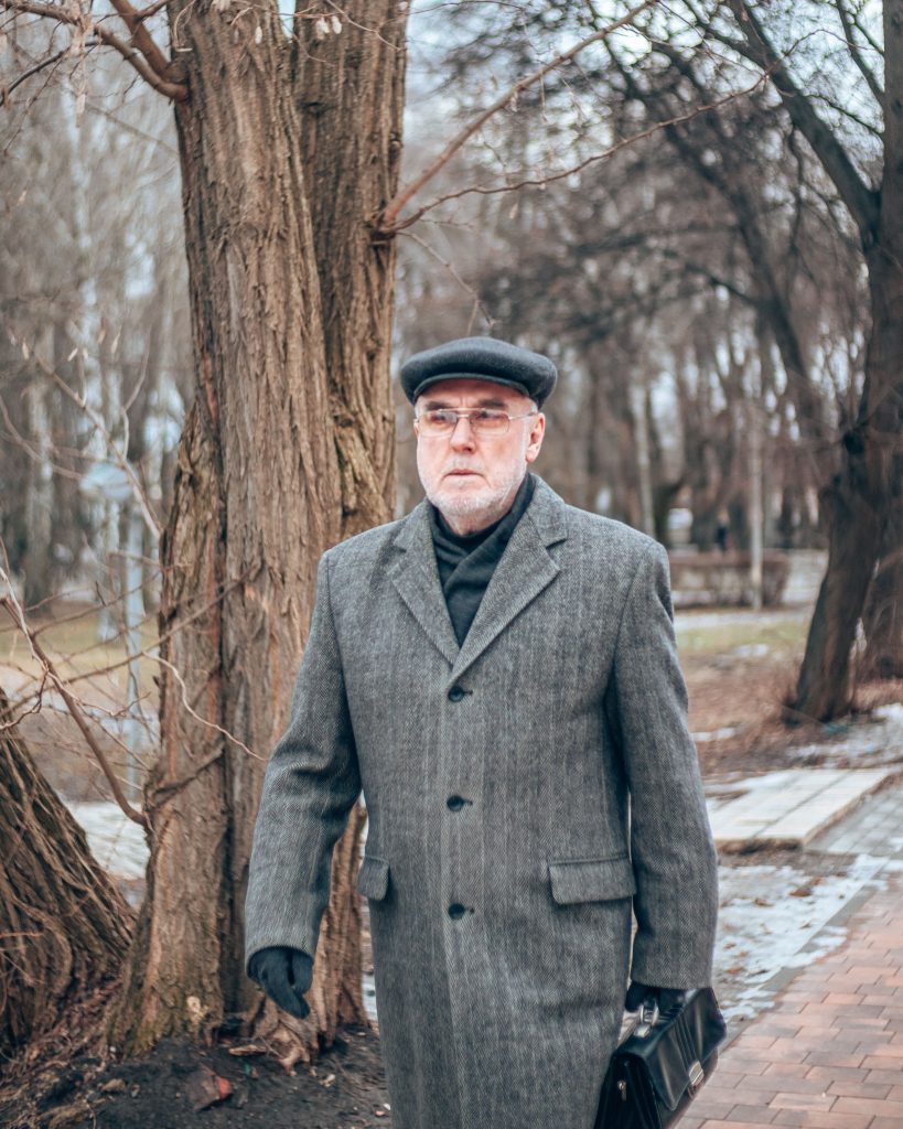 Stylish gentleman wearing timeless menswear in the city.